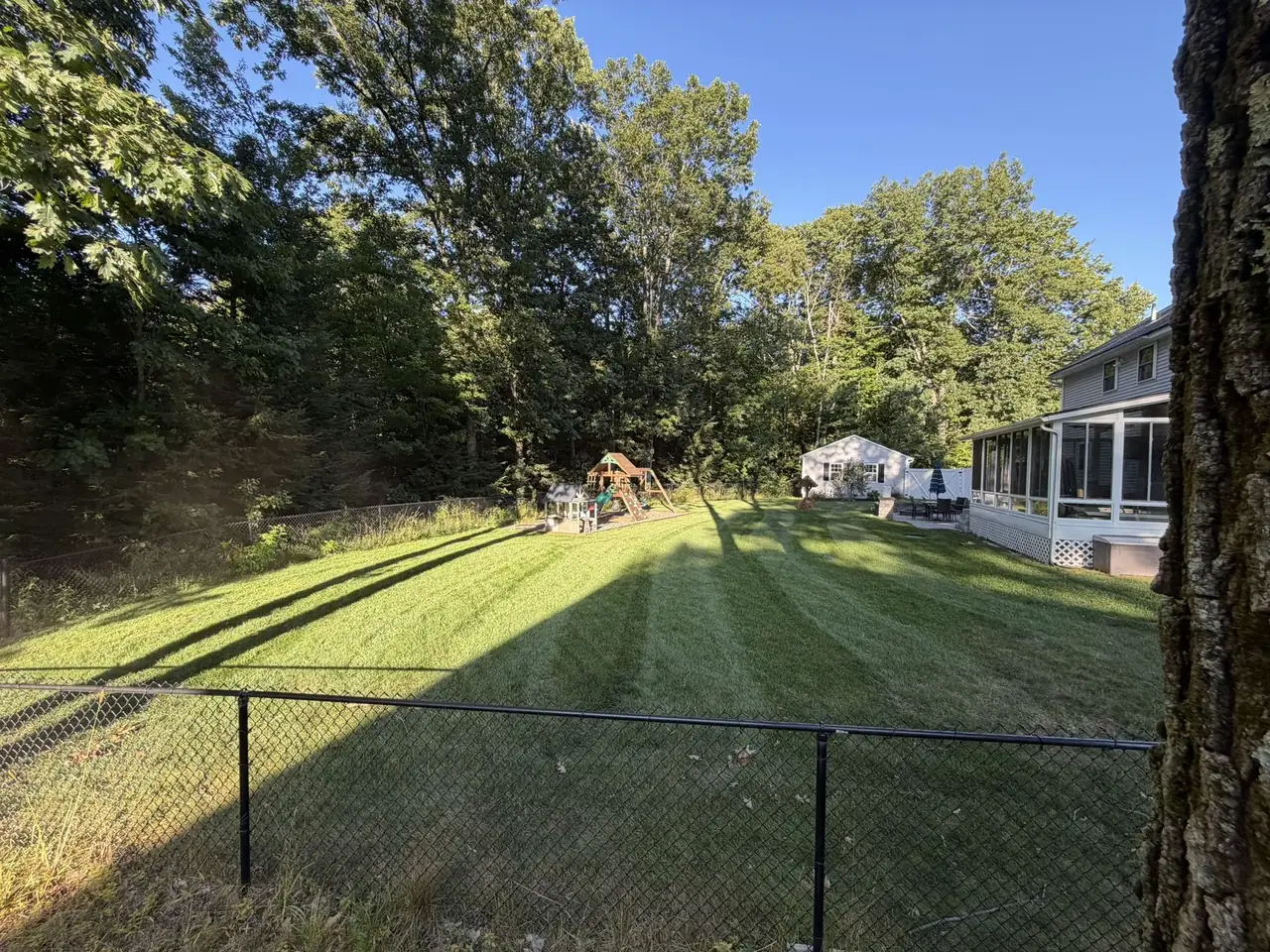 Striped fenced backyard in Southern New Hampshire